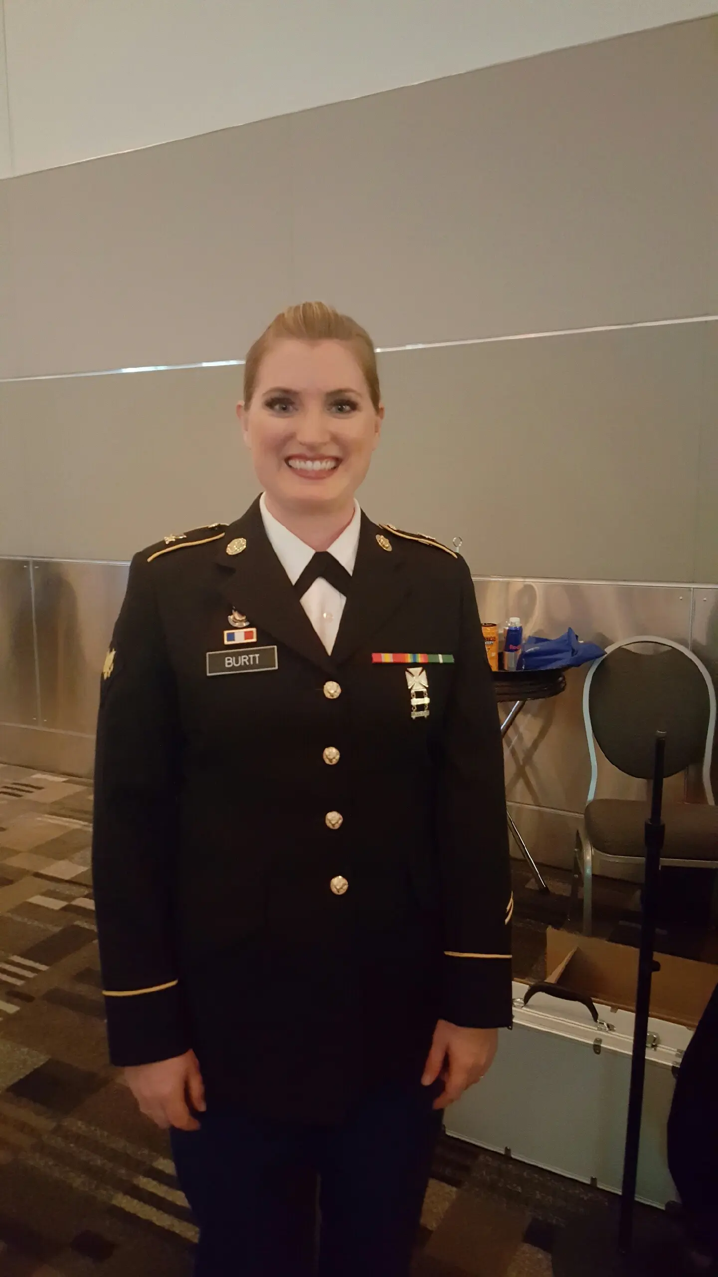 Tricia Scheer standing in military dress.