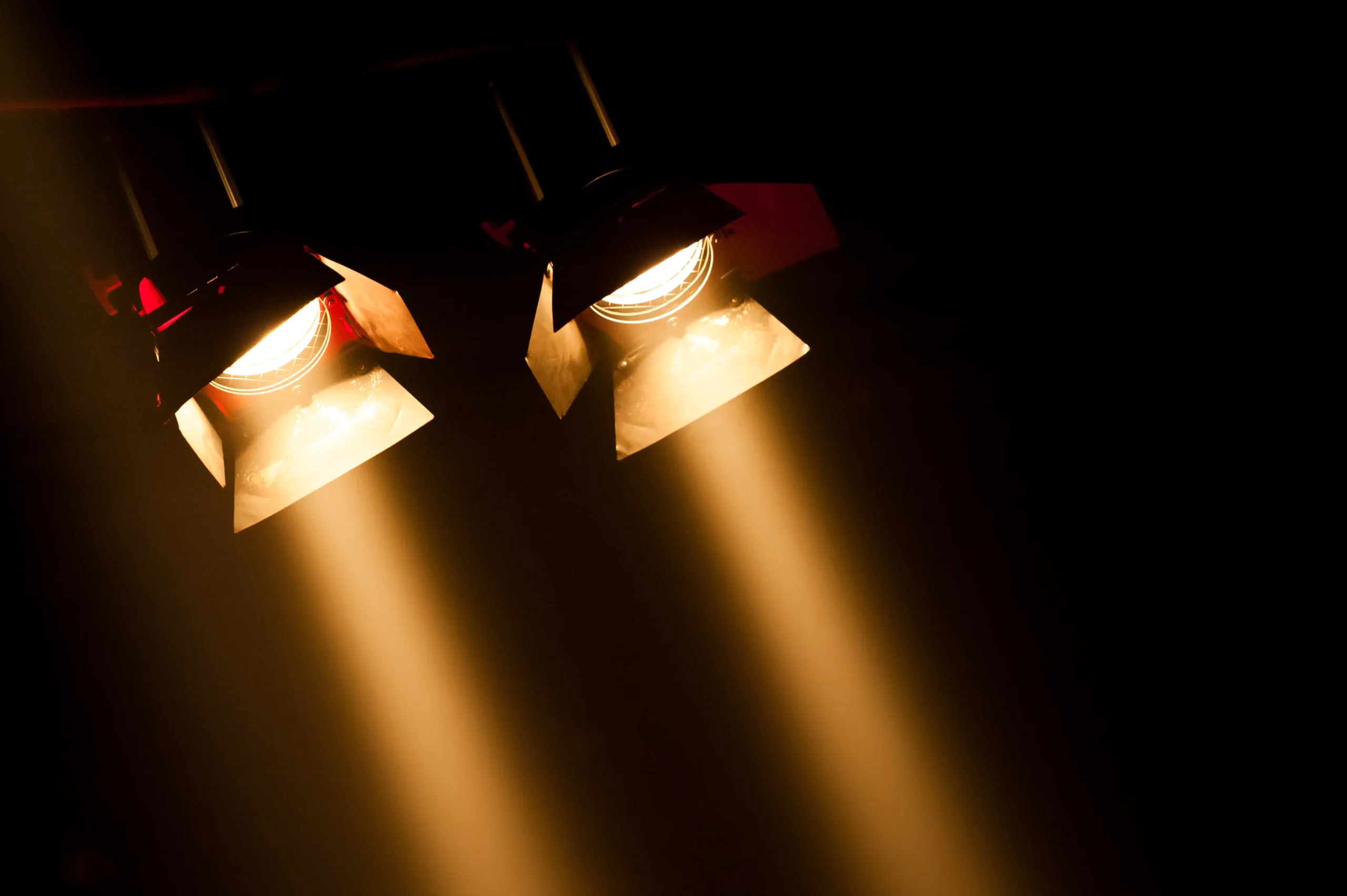 Two spotlights at a local theatre.